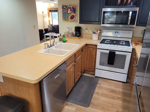 KITCHEN:  The home has a large and modern kitchen with all appliances (including a dishwasher) and a good supply of cooking and dining utensils.