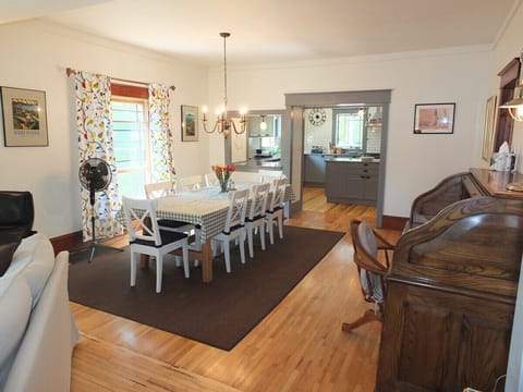 DINING AREA:  The house has a nice dining area with a large dining table with seating for up to 8 adults.  There is also a beautiful chandelier above the dining table!