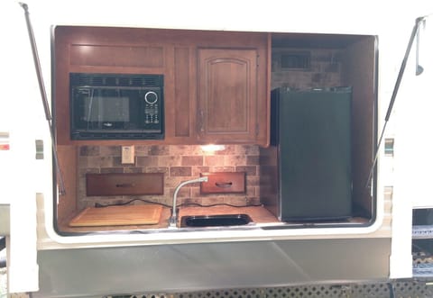 EXTERIOR:  The cute little outdoor kitchen that is included.