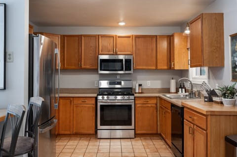 The fully-stocked kitchen is equipped with a dishwasher, toaster oven, blender, crock pot, and hybrid coffee pot which brews a full pot for the group or just one cup using your favorite Keurig flavor you brought from home.