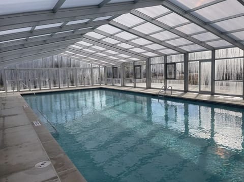 New Heated Pool with Retractable Cover! Enclosed for winter enjoyment and conveniently located across from home.  