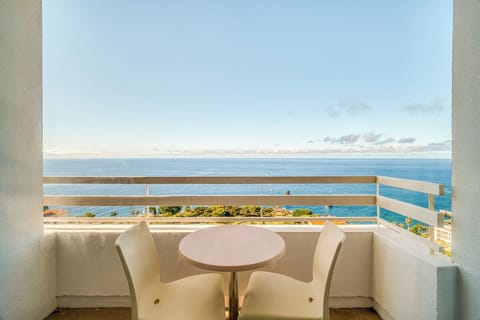 Step onto the balcony and soak up endless sea views.
