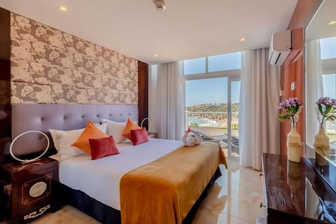 Wake up to sunshine and balcony views from bed.