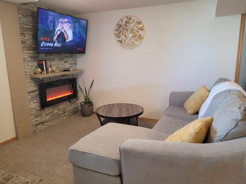 Living room with electric fireplace and 55" Samsung tv