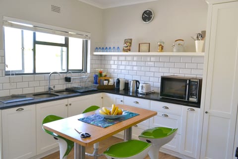 The kitchen features an extra-large microwave and all the cookware you will need