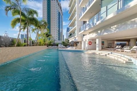 Dive into our inviting pool, its brilliant blue waters set against lush greenery. Relax on a comfortable chair, soak up the sun, and enjoy a tranquil escape.