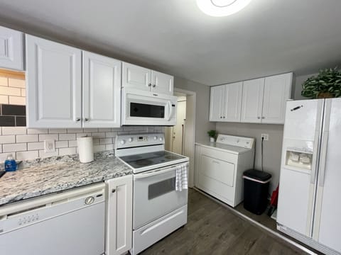 Kitchen stove; dishwasher, refrigerator and dryer