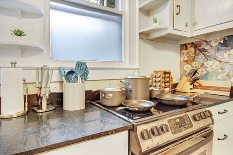 Fully Stocked Kitchen with pots, pans, knives, utensils, all the typical kitchen supplies, plus salt, pepper, a variety of seasonings, and olive oil.