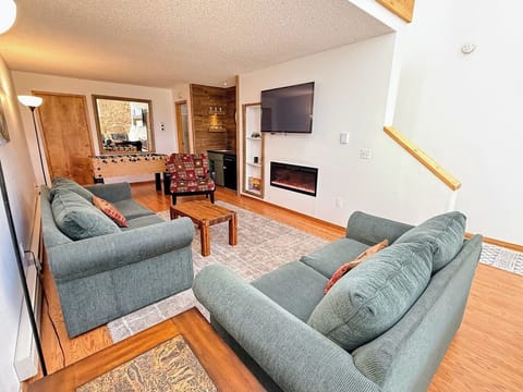 The green couch pulls out to a full-size bed.