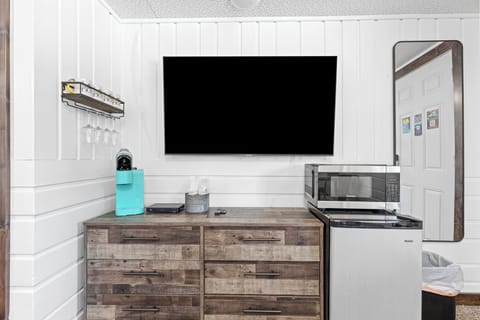 Flat screen Tv with cable package, large dresser, mini fridge, microwave and keurig coffee maker