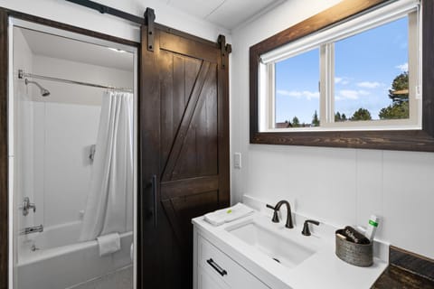Bathroom with barn style door to
