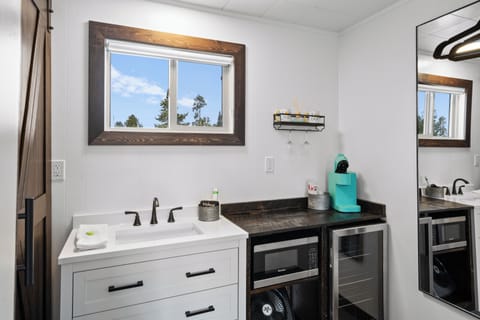 Bathroom sink, microwave, mini fridge and Keurig coffee maker