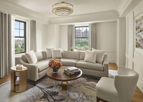Relax into plush seating with calming park-side scenery.