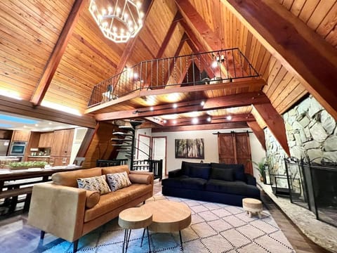 View of living room, loft and kitchen