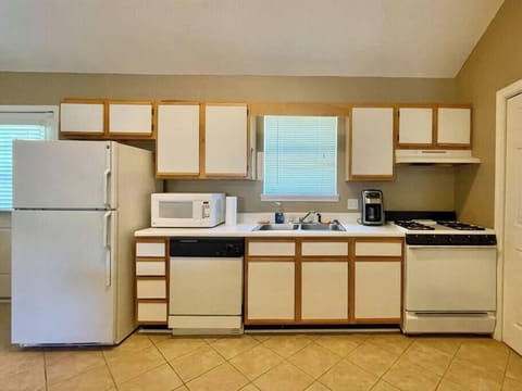 Additional kitchen view from bar.