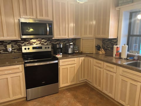  Stainless steel appliances and recently installed tile back splash.