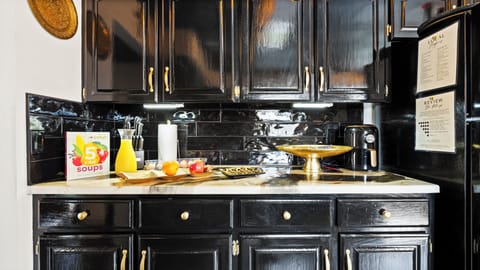 Fully stocked kitchen with wine, snacks, and chef tools