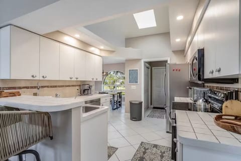 skylight allows for natural light to flood the kitchen