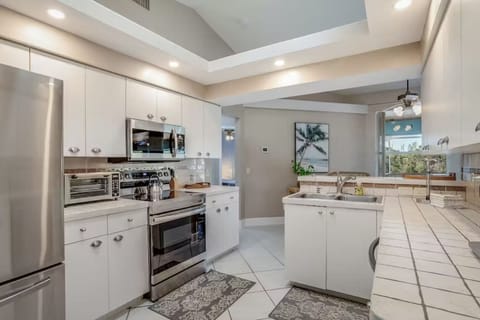 roomy kitchen has new appliances and spacious countertops