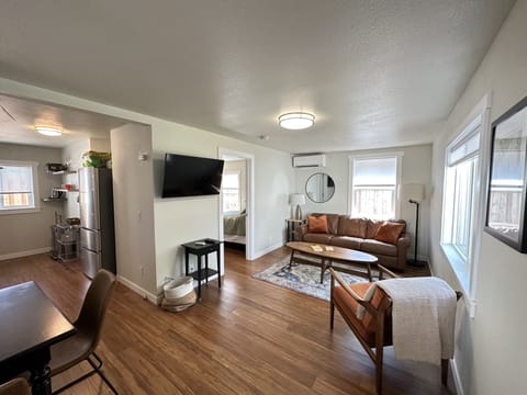 Living room, dining and kitchen. Leather sofa with a pull out bed.