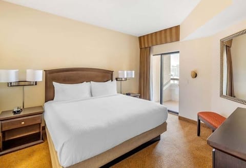 Sink into crisp bedding and step out to the balcony.