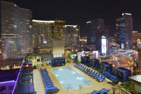 Marvel at the glittering skyline from your rooftop oasis.