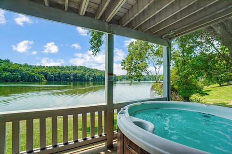 Relax in the hot tub while enjoying breathtaking views of Lake Logan.