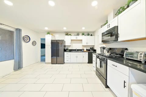 Large open kitchen equipped w/ stove, oven, microwave, toaster oven, coffee pot