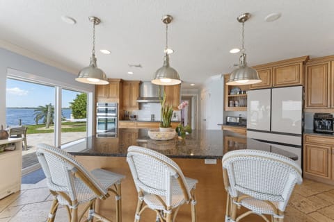 Well appointed kitchen with island bar seating