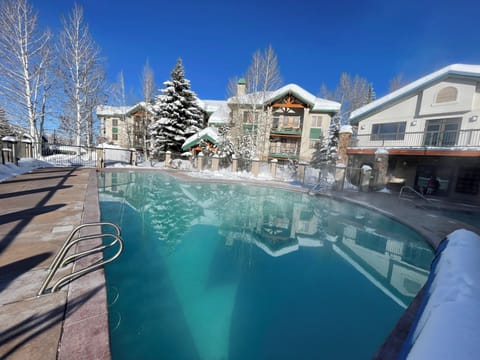 The pool, with the Spa condo in the background (L) & amenities building (R)