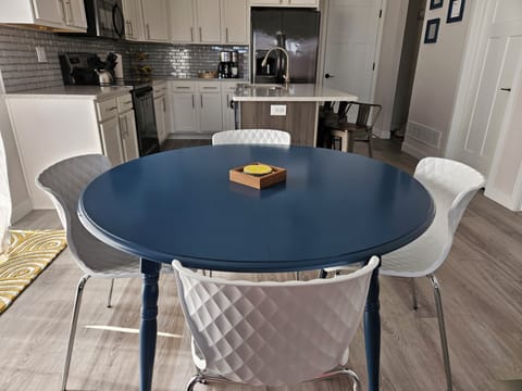 Dining table has optional leaf to seat up to 6 people