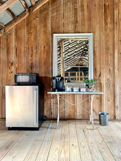 The kitchenette has a Keurig, mini fridge and microwave