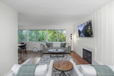 Sunny Living Room Overlooks Private Backyard
