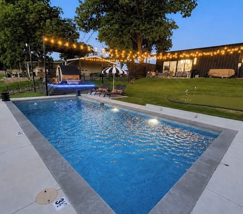 Lake Granbury after dark... pool, sauna, hot tub, putt-putt & string lights.