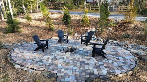 Enjoy a fire and smores in our lovely stonework firepit!