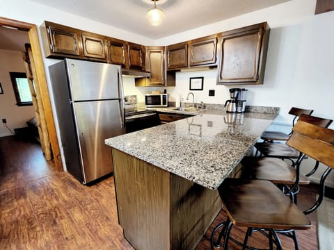 Fully equipped kitchen with dishwasher dishes & utensils for adults & kids.
