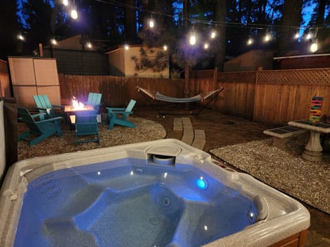 Hot tub, fire pit table, hammock (removed in winter), picnic table
