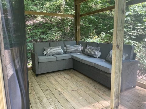 Walk out from the covered porch out to the fire pit.