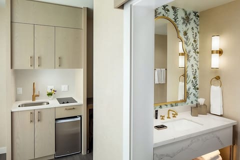 Enjoy easy snacks with an in-room kitchenette and vanity.