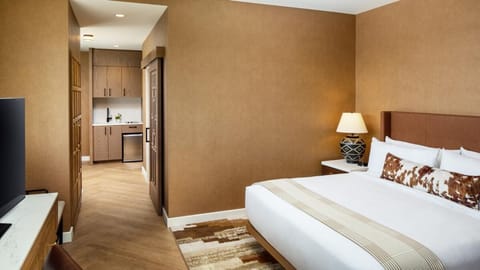 Gather for drinks in plush seating under warm, soft lighting.