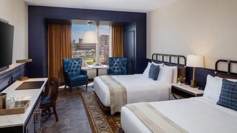 Unwind in a bright double-queen room with city views.