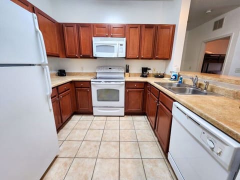 - Fully equipped kitchen - modern appliances and spacious counters perfect for family cooking near Disney World  
