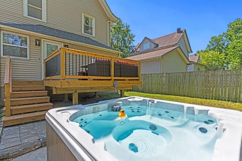 Private backyard hot tub just steps from the deck—perfect for relaxing after exploring Kansas City.