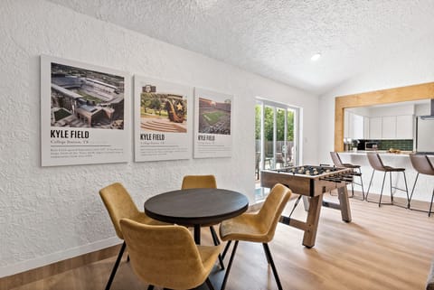 Good room oasis: enjoy fun-filled moments with foosball and Kyle field art. 