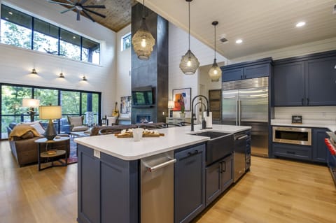 Kitchen: Stylish space with ample natural light, perfect for culinary adventures and gatherings!