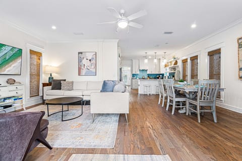 First Floor Living Room-Relax and recharge—literally! Our couch comes equipped with built-in USB ports, letting you unwind comfortably while keeping your devices charged for your convenience. There is also a tv, games and easy access to the front porch.