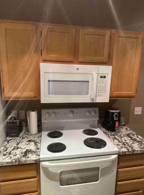 Stove, microwave, and kitchen essentials included.