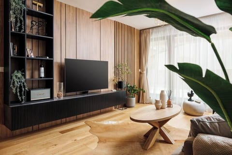 Stylish living room with couch and an 120cm wide Smart TV 