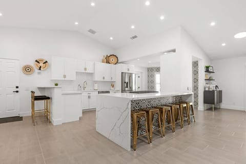 Completely redone kitchen, two kitchen bars with setting for 8. 