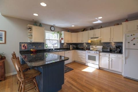 Experience luxury in the spacious kitchen with granite countertops.